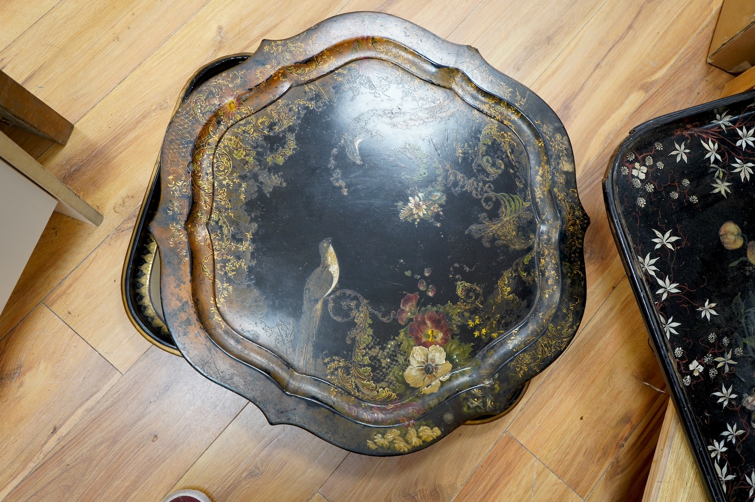 Three large Victorian papier mâché trays, largest 71cm wide. Condition - all have faults